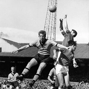 Peter Broadbent jumps high but cannot get his head to the ball as Bonetti the Chelsea
