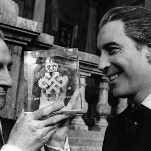 Peter Cushing actor (L) with Queens Award for Industry awarded to Hammer Films with