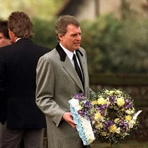 Peter Dean Actor carrying a wreath at the funeal of Mark Reid the son of Comedian Actor