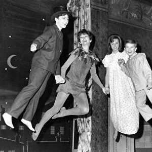 Peter Pan takes off. Dawn Addams (second from left) with Alison Frazer, as Wendy