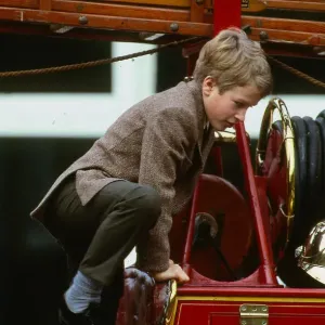 Peter Phillips January 1988 son of Princess Anne scrambles over top of old fire