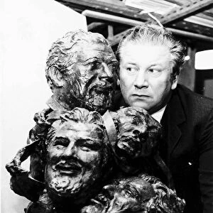 Peter Ustinov Film Actor with some bronze sculptures of his face