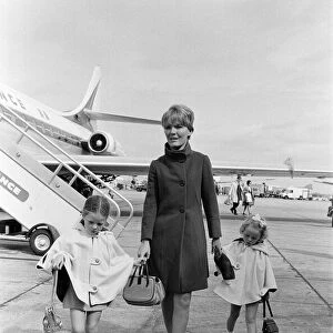 Petula Clark arriving at London Airport from Paris with her two children, Barbara, 4