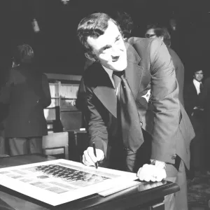 Phil Bennett signing the visitors book at the International Sports Writers Club in Great Phil Bennett signing the visitors book at the International Sports Writers Club in Great