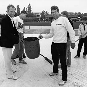 Phil Carrick Yorkshire skipper along with Sussex captain Paul Parker help with clearing