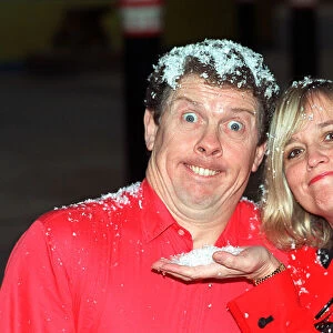 Phil Cool comedian and actress Susan Penhaligon Nov 1990 covered in snow