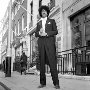 Phil Lynott of Thin Lizzy modelling clothes from Saville Row, London Phil Lynott of Thin Lizzy modelling clothes from Saville Row, London