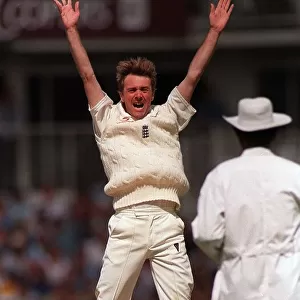 Phil Tufnell of England aug 1999 leaps into the air after taking the wicket of