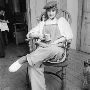 Photo shows Helen Mirren seated in her country Windsor chair wearing her favourite cap Photo shows Helen Mirren seated in her country Windsor chair wearing her favourite cap