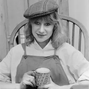 Photo shows Helen Mirren seated in her country Windsor chair wearing her favourite cap Photo shows Helen Mirren seated in her country Windsor chair wearing her favourite cap