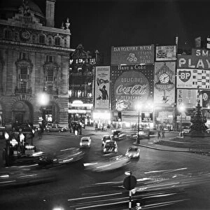 Piccadilly Circus at night. London. Picture shows the scene where the Advertising
