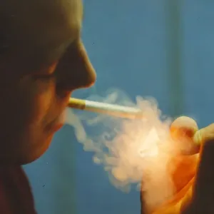 A picture of a man (Posed model) smoking