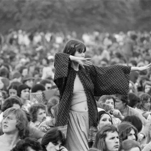 Picture shows a fan dancing amongst the huge audience at London Hyde Park for a concert Picture shows a fan dancing amongst the huge audience at London Hyde Park for a concert