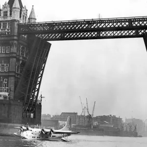 Picture shows the first flying boat on the Thames for 21 years-passing under Tower Bridge Picture shows the first flying boat on the Thames for 21 years-passing under Tower Bridge