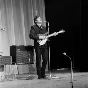Picture shows John Lennon. The Beatles rehearse at The Prince of Wales Theatre in