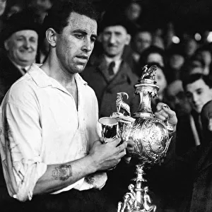 PICTURE SHOWS: Mr E. J. Morgan (vice-president) presenting the Welsh Cup to Roy Paul