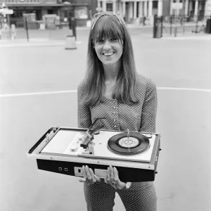Picture shows The Ready Steady Go TV pop show presenter Cathy McGowan holding a Picture shows The Ready Steady Go TV pop show presenter Cathy McGowan holding a