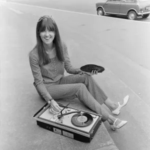 Picture shows The Ready Steady Go TV pop show presenter Cathy McGowan holding a Picture shows The Ready Steady Go TV pop show presenter Cathy McGowan holding a