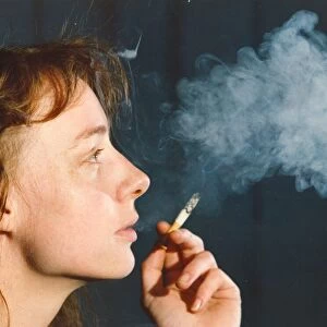 A picture of a woman (Posed model) smoking