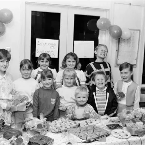 Pictured at their cake stall are these Thurstonland youngsters who have raised 100 for