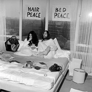 Pictured on their "honeymoon"bed newly weds. John Lennon