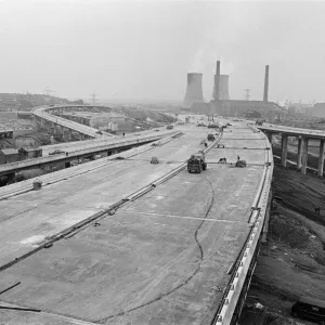 Pictured, workmen put last minute touches to a section of the M6 Gravelly Hill Pictured, workmen put last minute touches to a section of the M6 Gravelly Hill