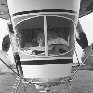 The pilot at the controls of Goodyear airship Europa seen here moored outside the giant