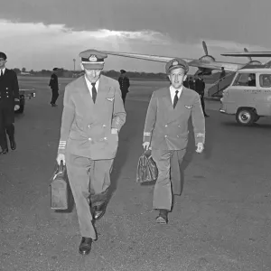 The pilot and flight engineer of Overseas Aviation walk towards the terminal at Gatwick The pilot and flight engineer of Overseas Aviation walk towards the terminal at Gatwick