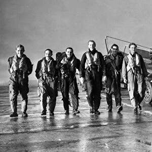 Pilots of 3613 Fighter Control Unit of the Royal Auxiliary Air Force make their way to