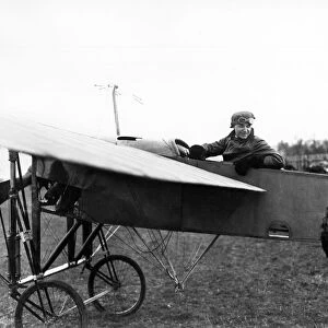 Pioneer British aviator Gustav Hamel pictured in a plane, circa 1913