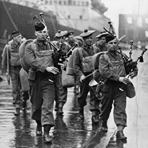 The Pipe Band of the Canadian Army arrive at Liverpool, Merseyside, in May 1940