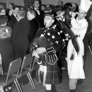 Pipe Major J. C. Mason piping in the haggis for the Newcastle