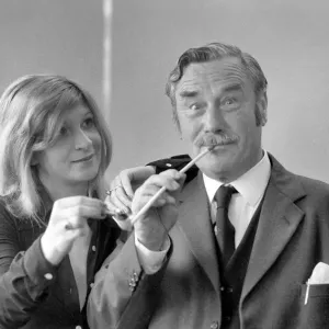 Pipe smoking Champion Robert Locke of Hayes, Middlesex, is pursued by typist Liliana Pipe smoking Champion Robert Locke of Hayes, Middlesex, is pursued by typist Liliana