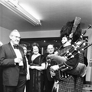 A piper welcomes the guest to the Birmingham and West Midlands Scottish Society Hogmanay