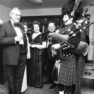 A piper welcomes the guest to the Birmingham and West Midlands Scottish Society Hogmanay