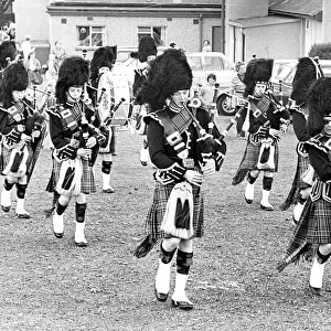 The pipes and drums of the Newcastle City Pipe Band opening a summer fayre in July 1981