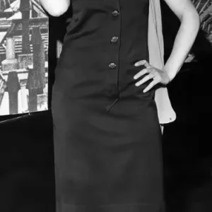 Black and white print of Pauline Boy in a halter-necked dress, orange scarf
