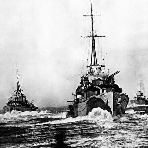 Ploughing steadily through the broken water, these destroyers of a British flotilla at