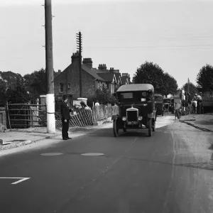 Police direct traffic as workmen repair the road in an unknown location in Uxbridge Police direct traffic as workmen repair the road in an unknown location in Uxbridge