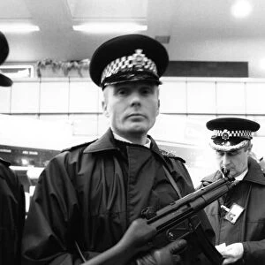 Police with machine guns at Heathrow airport. January 1986