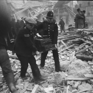 Police officers recover a cash register following a V2 attack on Sidmouth Street Police officers recover a cash register following a V2 attack on Sidmouth Street
