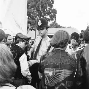 Police search the pockets of Hells Angels during the free Rolling Stones concert in Hyde Police search the pockets of Hells Angels during the free Rolling Stones concert in Hyde