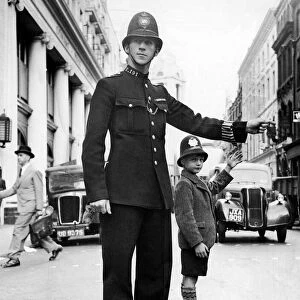 Policeman John Breeze on duty at the junction of Bow Street and Long Acre Road in London