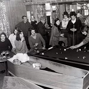 Pool players at the Smelters Arms in Castleside Co. Durham playing alongside a coffin in