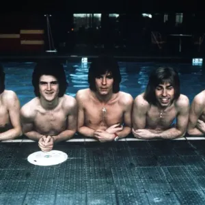 Pop group The Bay City Rollers pose in the swimming pool. 11th March 1975