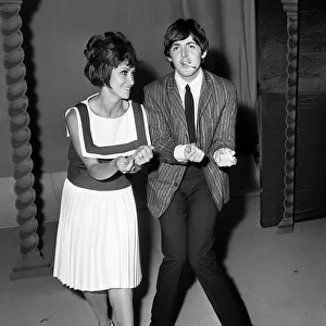 Pop Group The Beatles July 1964. Paul McCartney with singer Chita River during