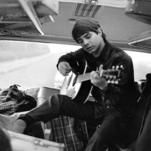 Pop group The Fourmost on tour Bertie Higgins of the Roemans group practices guitar