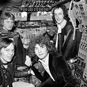 The pop group "Pilot"pictured here with Concorde. January 1975 75-00996