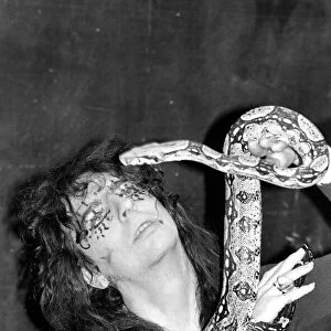 Pop singer Alice Cooper aged 23 flew into Heathrow Airport today with his pet boa