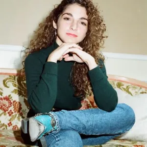 Gloria Estefan Sitting on a Sofa Print 1988